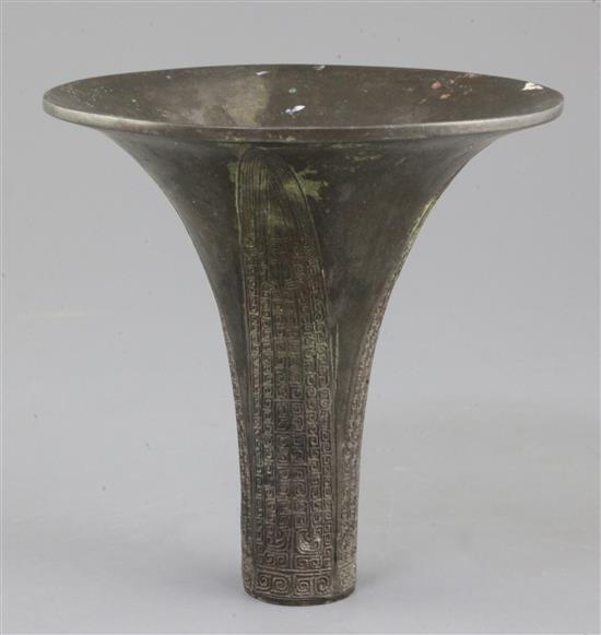 The upper fragment of a Chinese archaic bronze ritual wine vessel, Gu, Shang dynasty, 14th-12th century B.C., 10.5 cm high